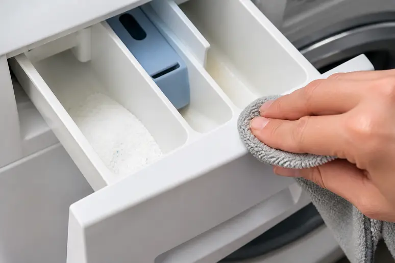 Entretien du bac à lessive pour une utilisation optimale : comment utiliser une machine à laver efficacement.